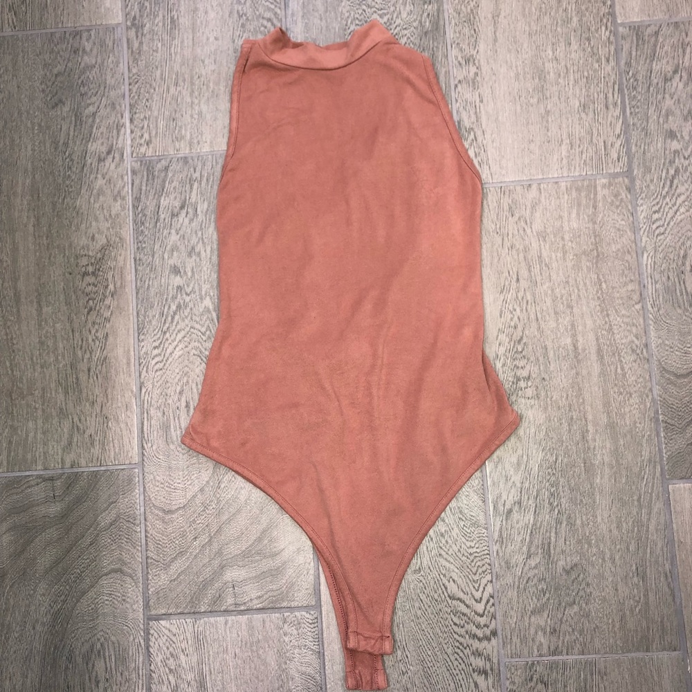 Cross back body suit